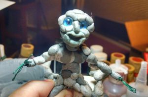 Pebble earth elemental sprite with test eyes